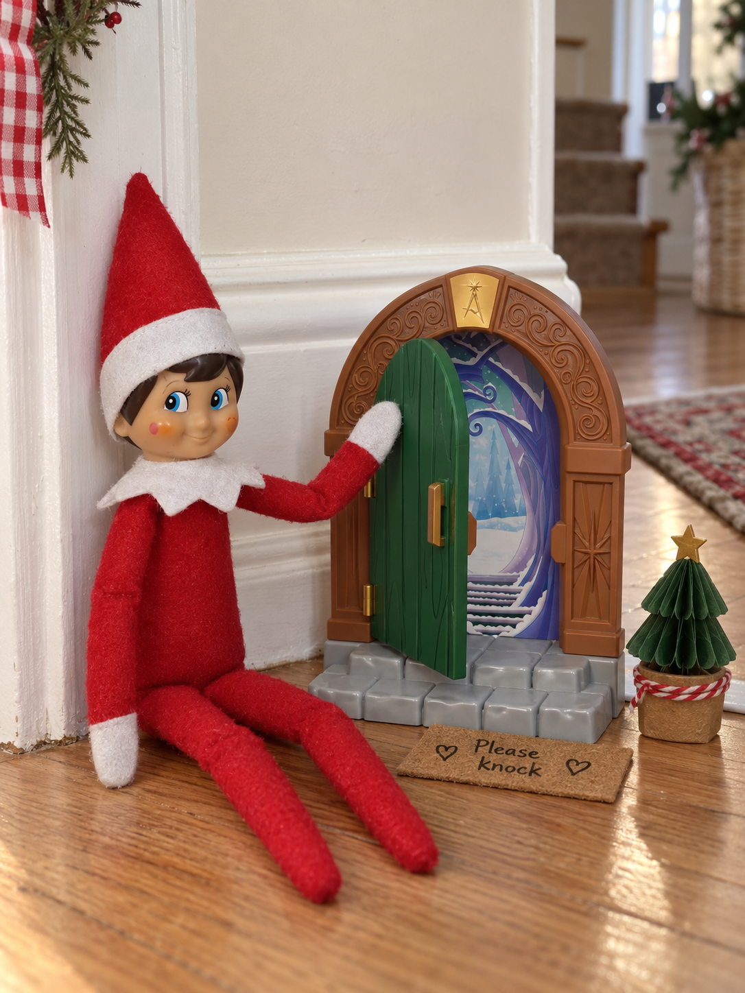 Tom the elf knocking beside a miniature green North Pole door with a paper doormat